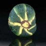 Ancient Egyptian glass bead with flower design mosaic cane